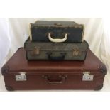 3 vintage suitcases.