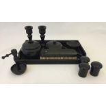 An Ebony men's dressing table set. Together with Bakelite containers.