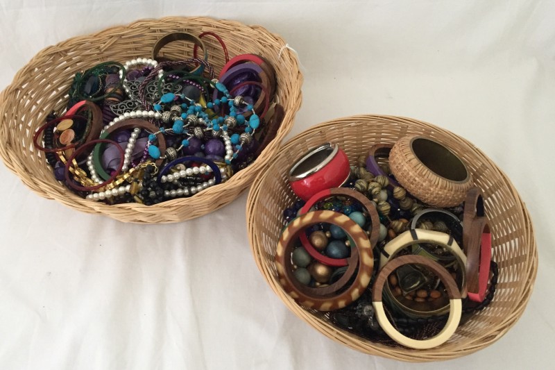 2 wicker baskets containing a large quantity of costume jewellery.