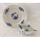 An 18th century Tournai blue and white porcelain sauceboat and plate.