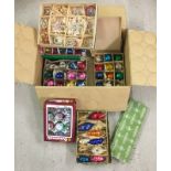 A box of assorted vintage glass baubles and Christmas decorations.