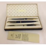 A boxed vintage Parker 45 De Luxe pen / pencil set in Navy blue and gold.