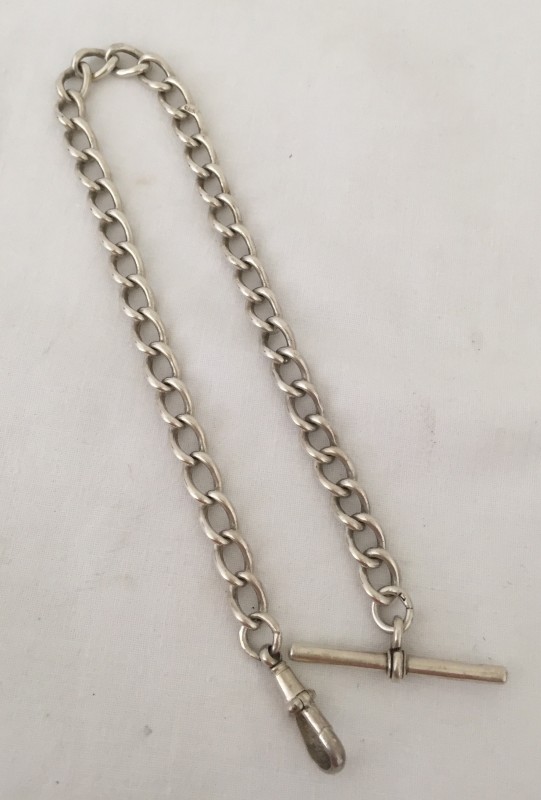 An antique hallmarked silver watch chain.