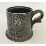 A salt glaze studio pottery mug by Walter Keeler.