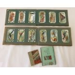 Two vintage cigarette card albums.