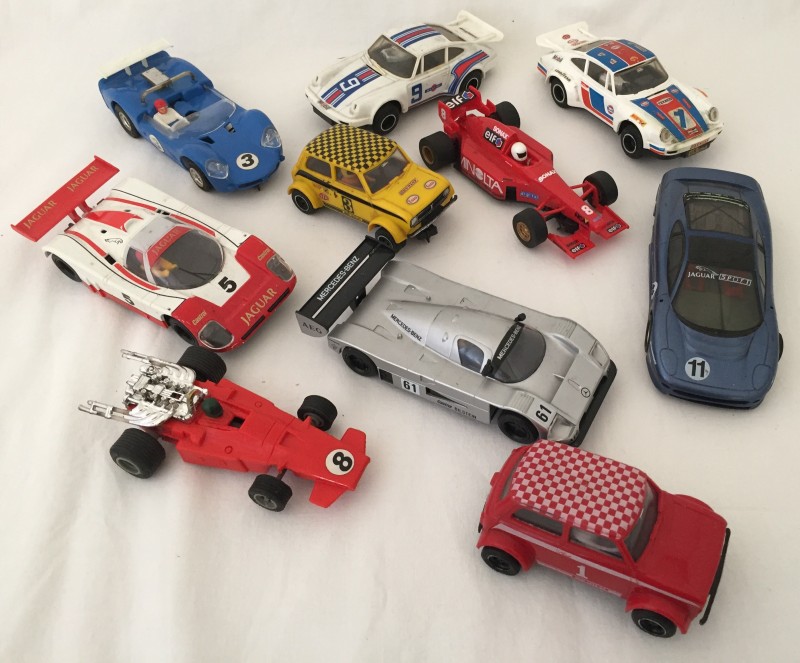 10 unboxed Scalextric slot cars.