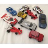 10 unboxed Scalextric slot cars.