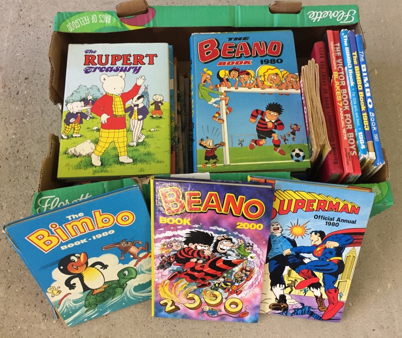 A box of children's books and annuals to include Rupert Bear.