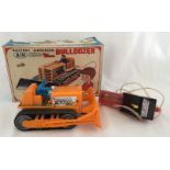 A boxed AIR battery operated remote control bulldozer.