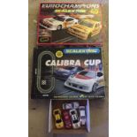 2 boxed Scalextric sets together with 5 misc Scalextric cars.