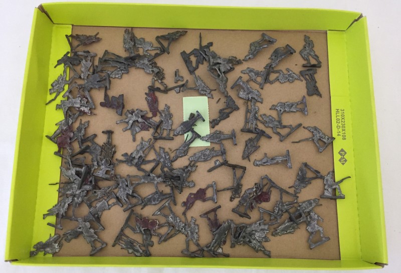 A tray of flat lead Napoleonic toy soldiers.