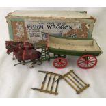 A vintage boxed Britains lead horse drawn Farm Waggon.