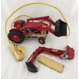A tinplate battery operated Ford 4000 tractor and loader.