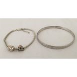 2 silver bracelets.