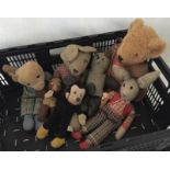 A collection of 7 vintage soft toys.