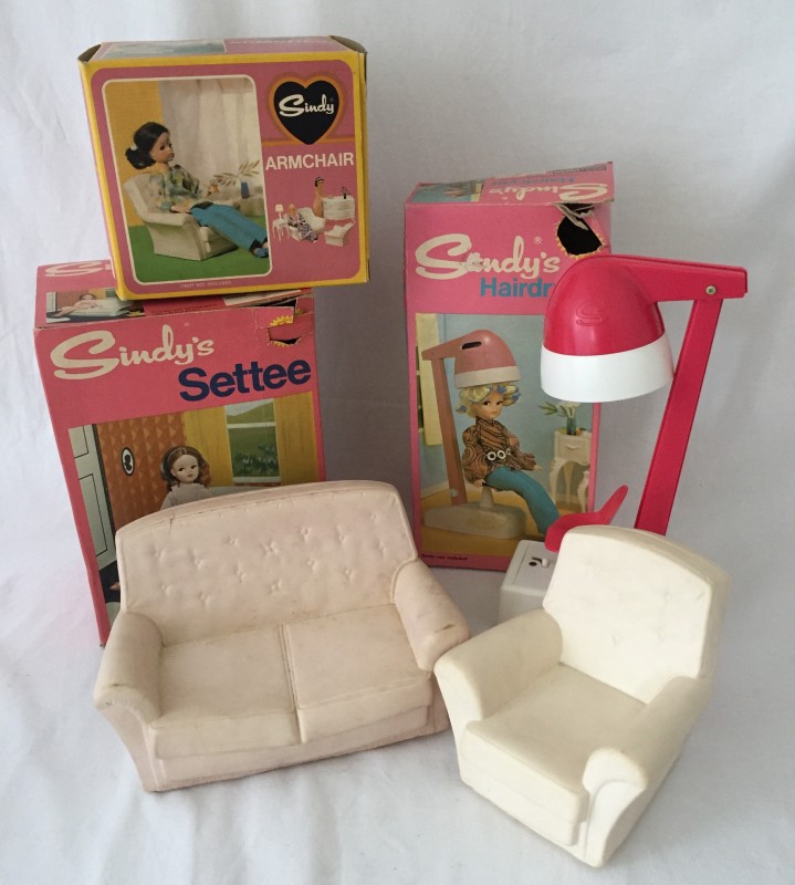 A boxed Sindy white sofa and boxed matching armchair.