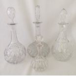 4 cut glass decanters. One with engraved vine decoration.