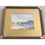 A small framed and glazed watercolour of a beach scene by M Scott.