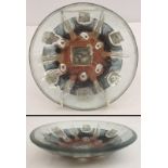 An art glass pin dish with neutral colours.