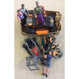 A box of modern Action man figures and accessories.