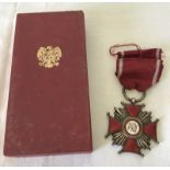 A Polish Cross of Merit silver award, with box and certificate.