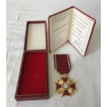 A gilt award Polish Cross of Merit, boxed and with certificate.