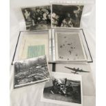 A folder containing a quantity of original military press photographs c1940' s to 1980's.