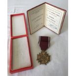 A boxed Polish Cross of Merit with certificate, bronze award.
