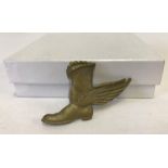 A WWII RAF late arrivals badge (winged boot).