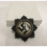 A German WWII Deutches Kreuz , No 1 (denotes Deschler & Sohn) stamped on pin.