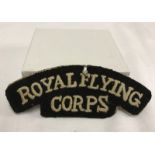 RFC a pair of Royal Flying Corps cloth shoulder titles with price label still attached.