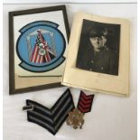 A WW2 Photograph of a US serviceman, cloth & metal badges.