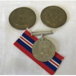 A set of 1939-45 War Medal dies, front and reverse, cancel stamped.