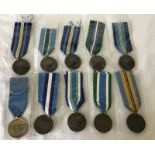 10 United Nations medals with different ribbon types.