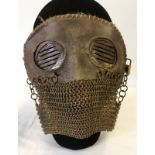 A scarce WWI pattern Anti splatter tank mask, complete with chain and straps.