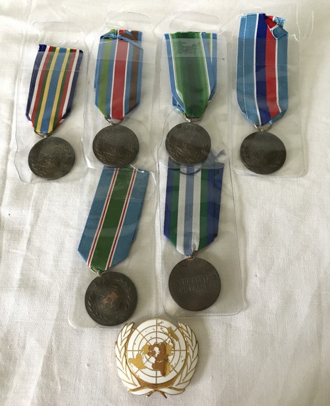 6 United Nations medals with different ribbon types.