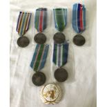 6 United Nations medals with different ribbon types.