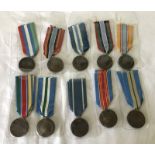 10 United Nations medals with different ribbon types.