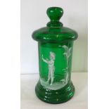 A green glass Mary Gregory style lidded jar.