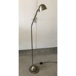 A modern brushed brass effect standard lamp with poseable light.