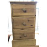 A solid pine 3 drawer bedside cabinet.