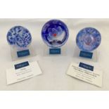 3 boxed Caithness paperweights in blue tones with original stands.