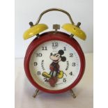 A vintage German Walt Disney Productions Mickey Mouse clock alarm clock.