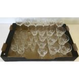 A box of assorted cut crystal glasses.