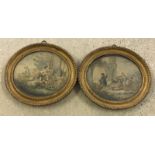 2 oval gilt framed coloured prints of classical scenes.