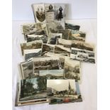 A collection of vintage postcards and photographs.