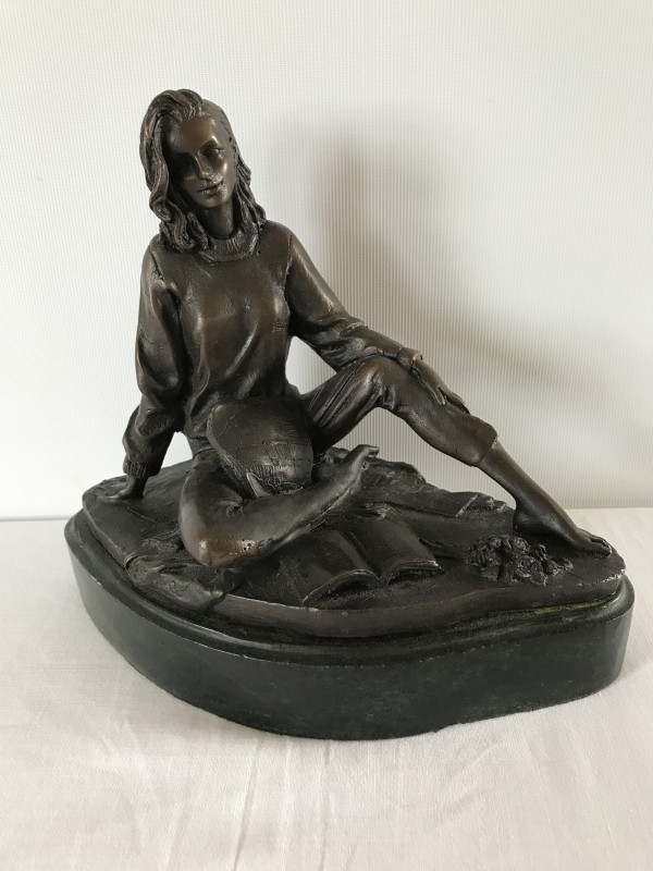 A bronze figurine on a marble base.