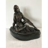 A bronze figurine on a marble base.