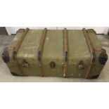 A vintage wooden banded travelling trunk.