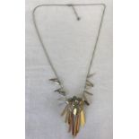 A modern design necklace by Swarovski. Set with metallic crystals.